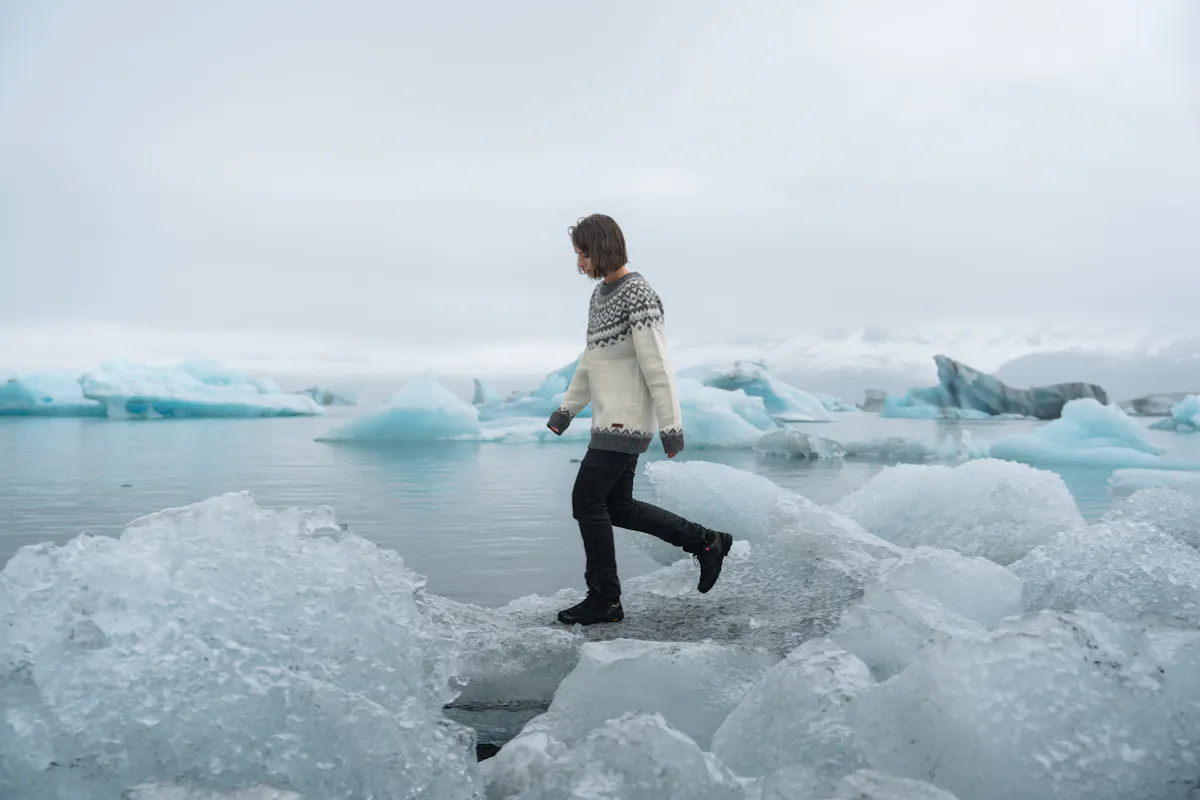 woman by glacier lagoon