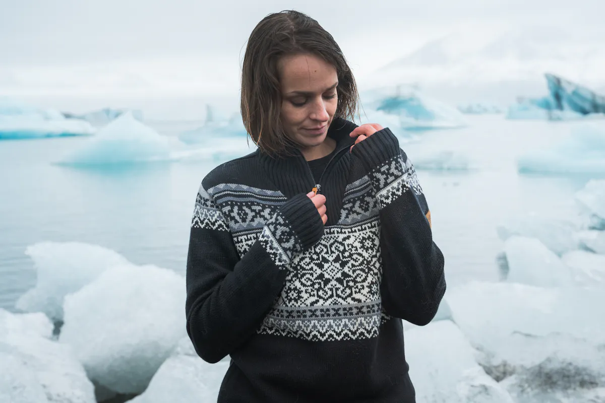 woman by glacier lagoon