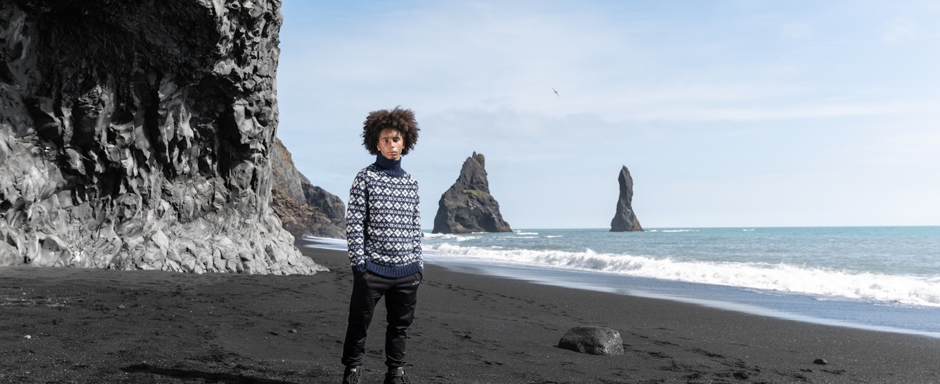 man on the black beach, south Iceland