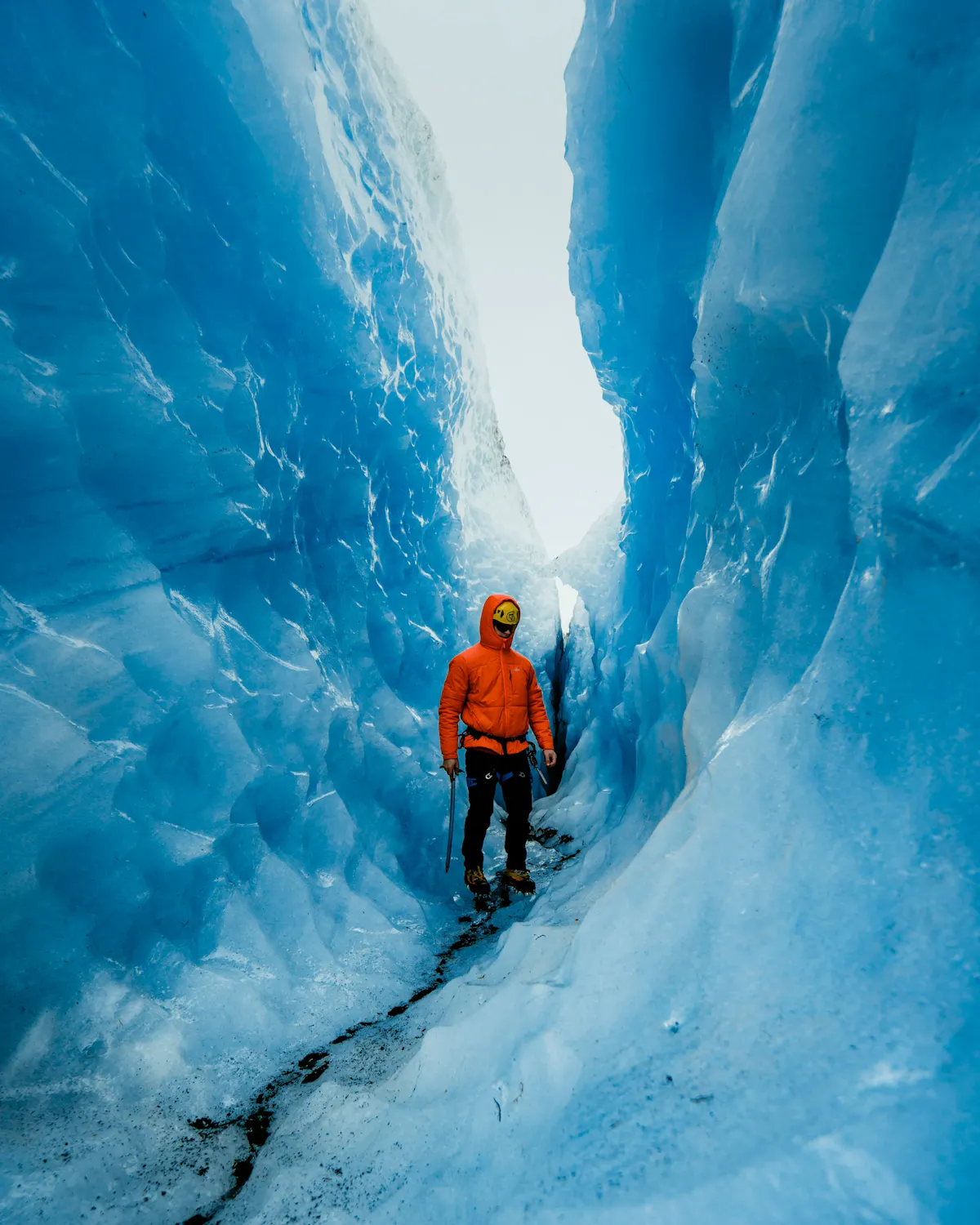 man hiking glacier