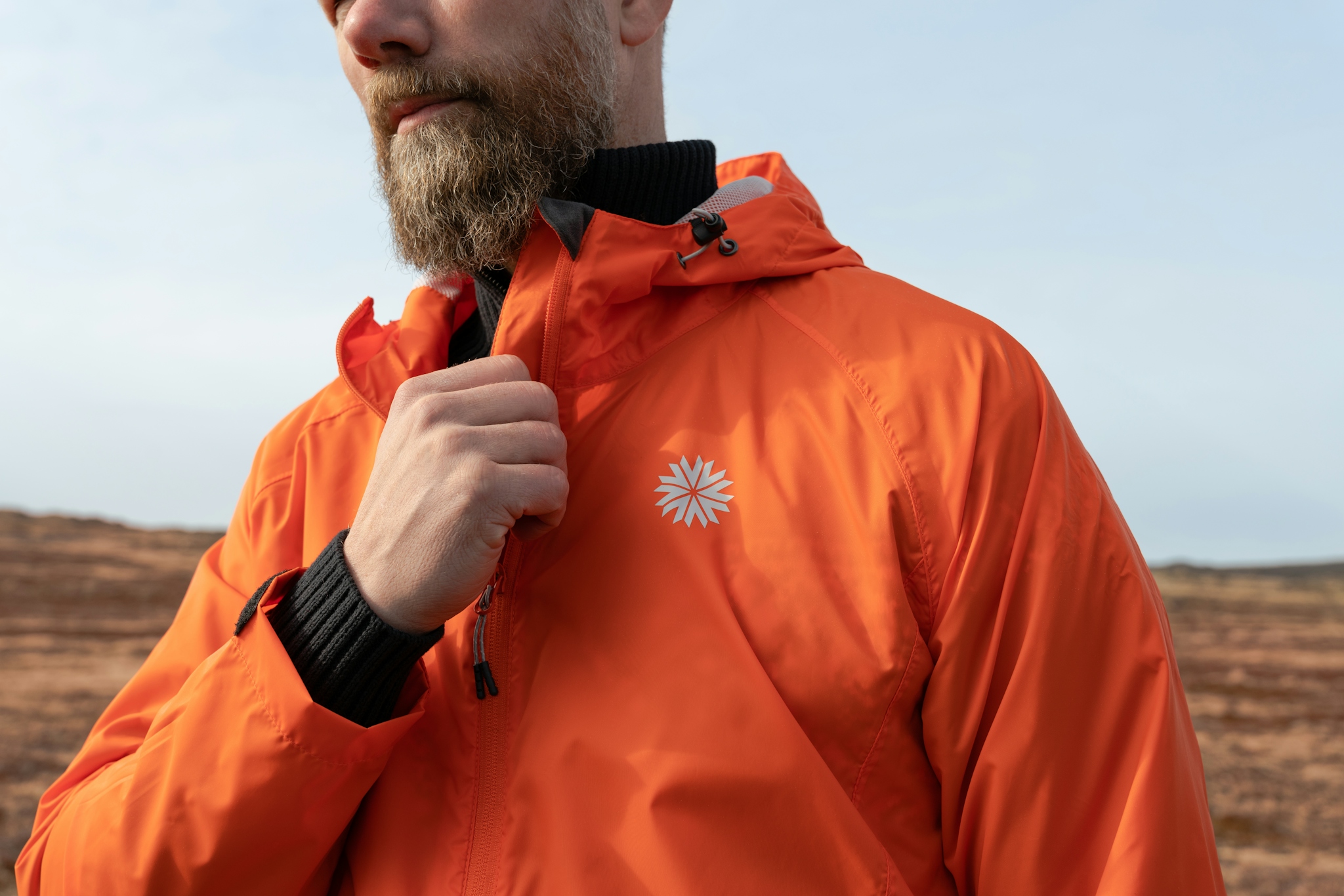 iceland-man-orange-windjacket-28.jpeg