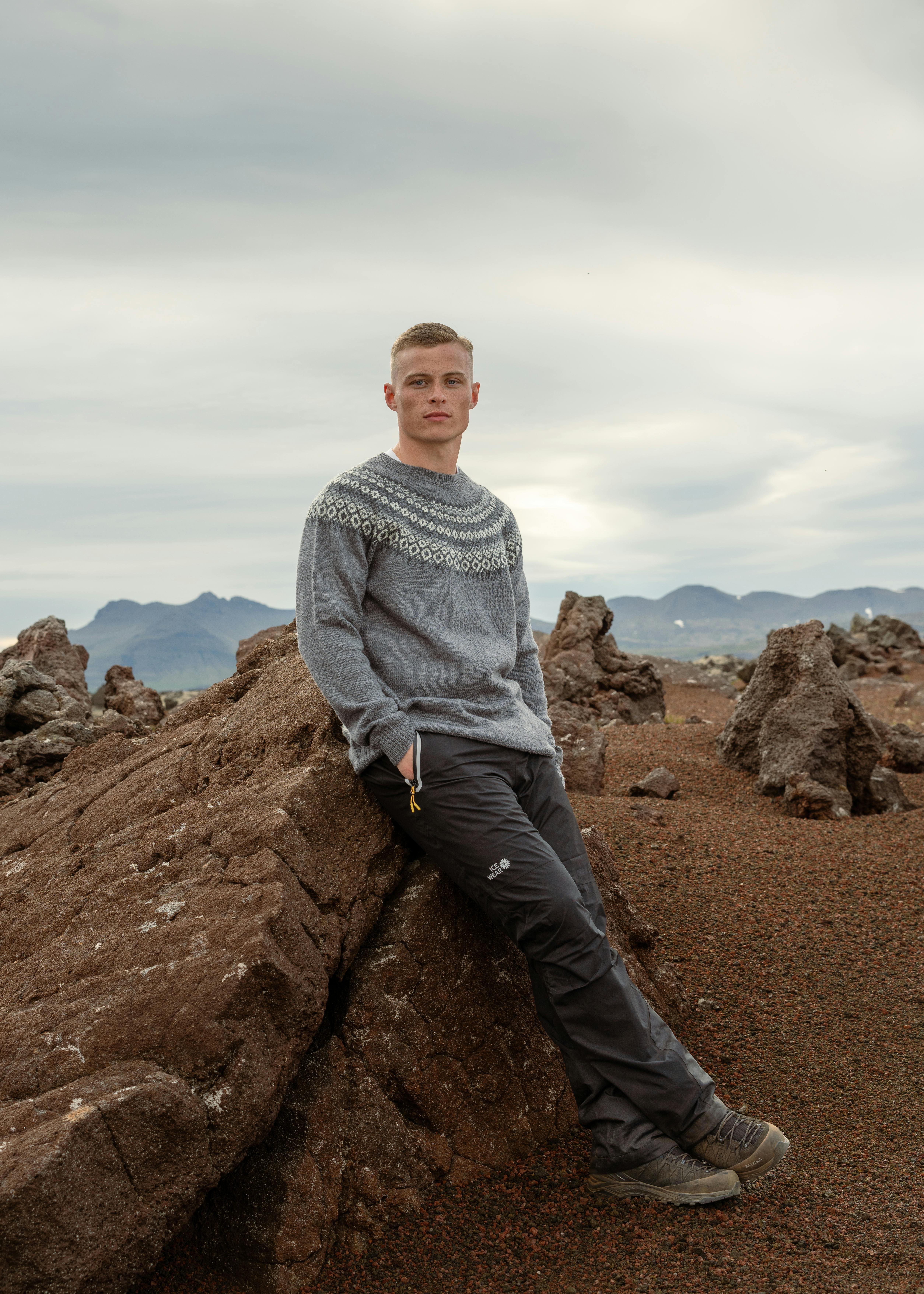 Man sitting on cliff