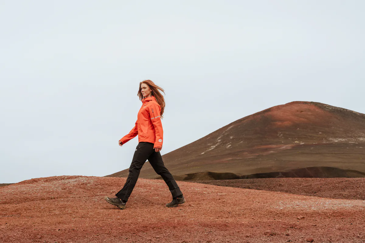 Woman walking in red desert