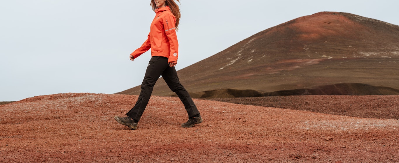 Woman walking in red desert