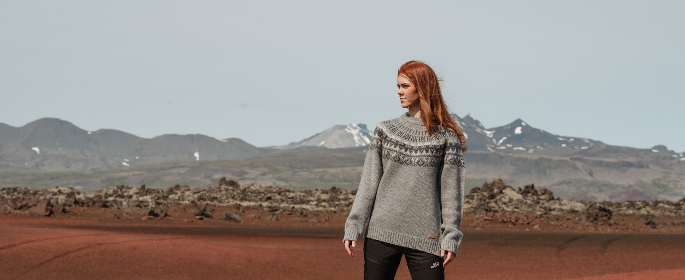 woman on the red sand in Vest Iceland
