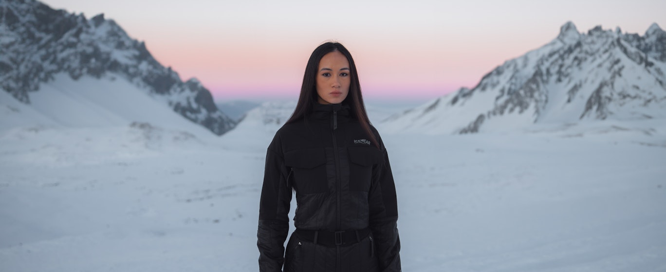 A woman up on a mountain, a lot of snow