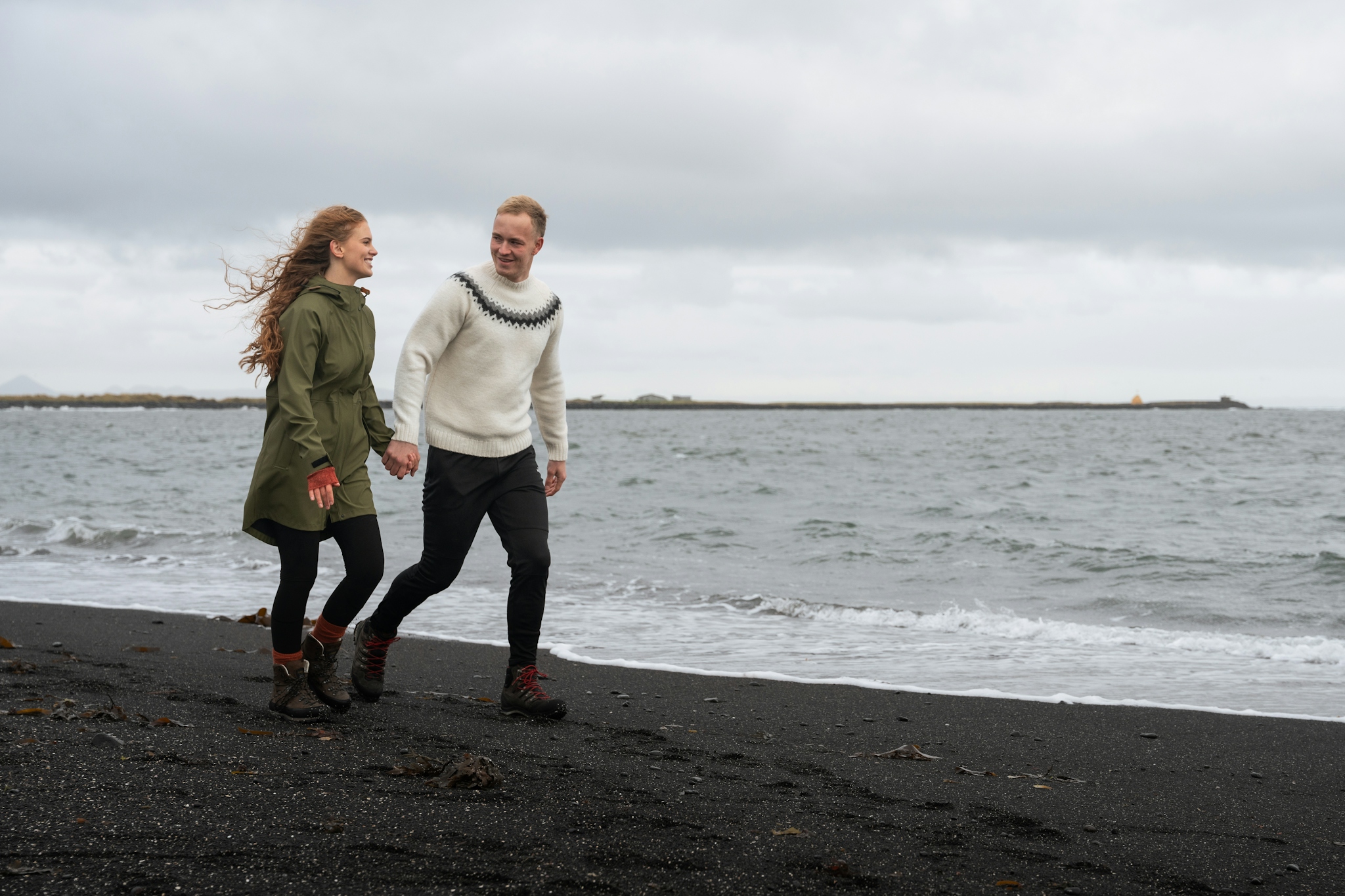 iceland-couple-handinhand-seashore.jpeg