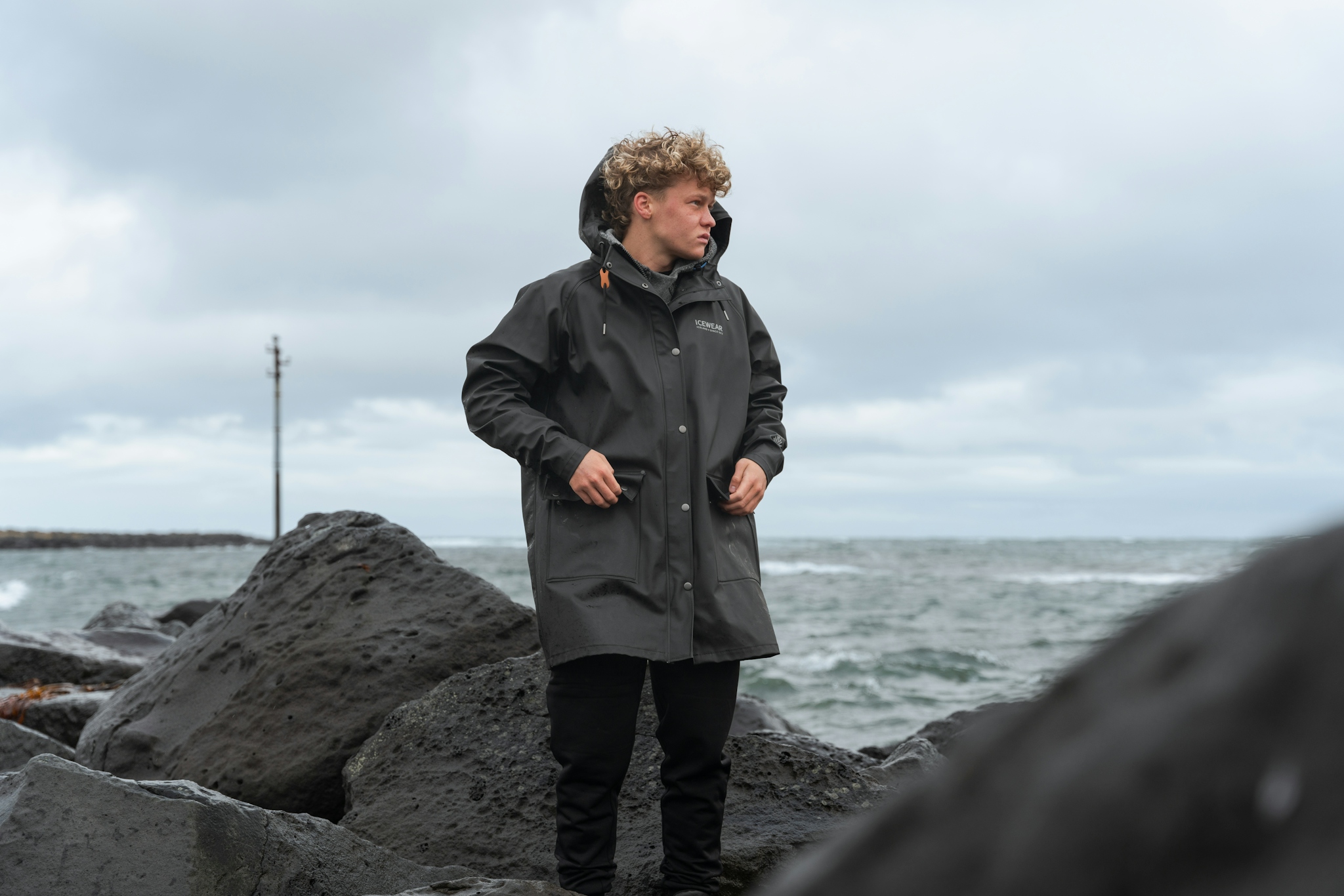 iceland-coast-sea-man-rainjacket_16.jpeg