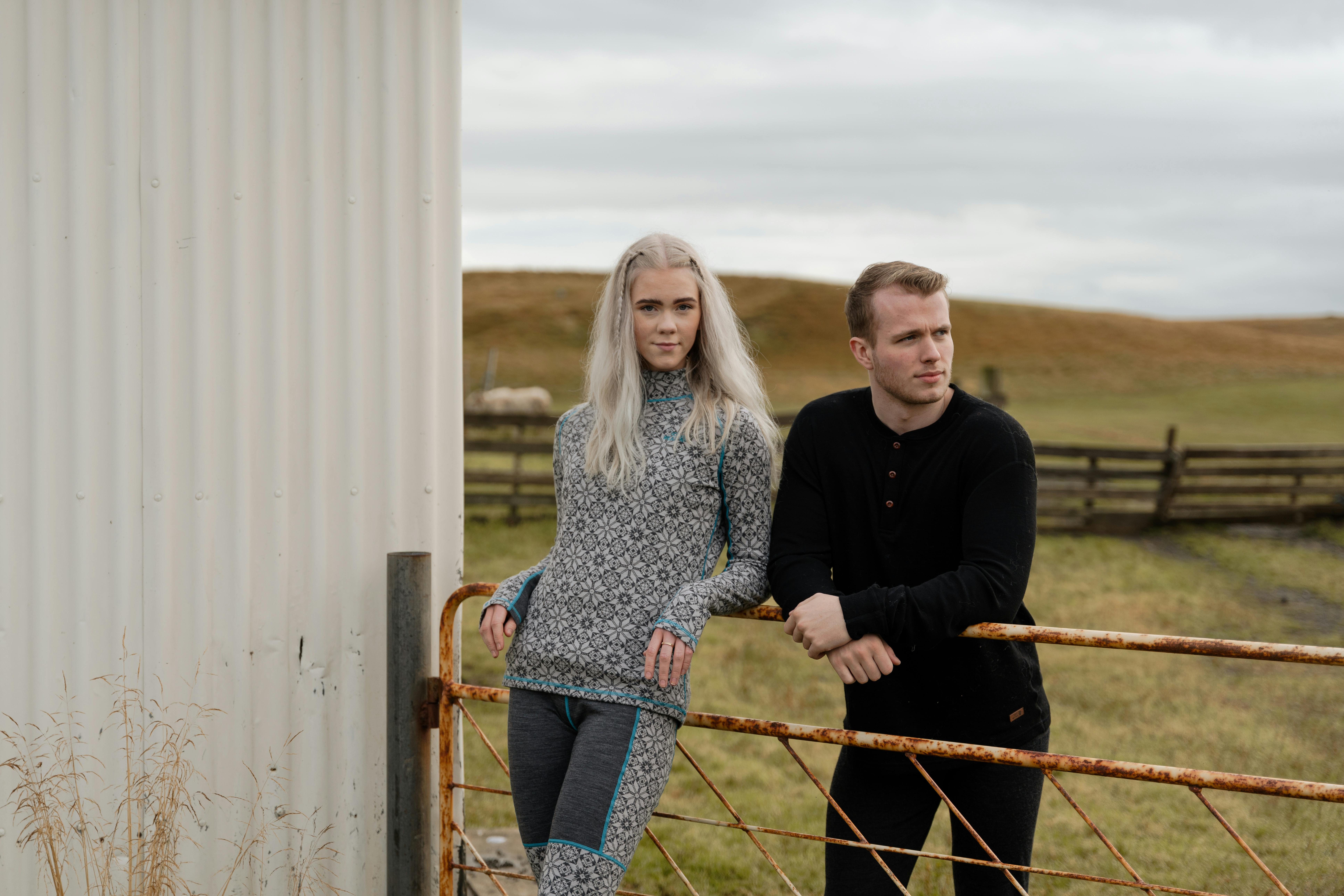 Couple at a fence by a farm