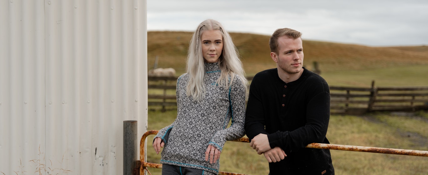 Couple at a fence by a farm