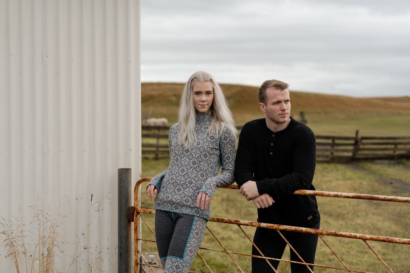 Couple at a fence by a farm