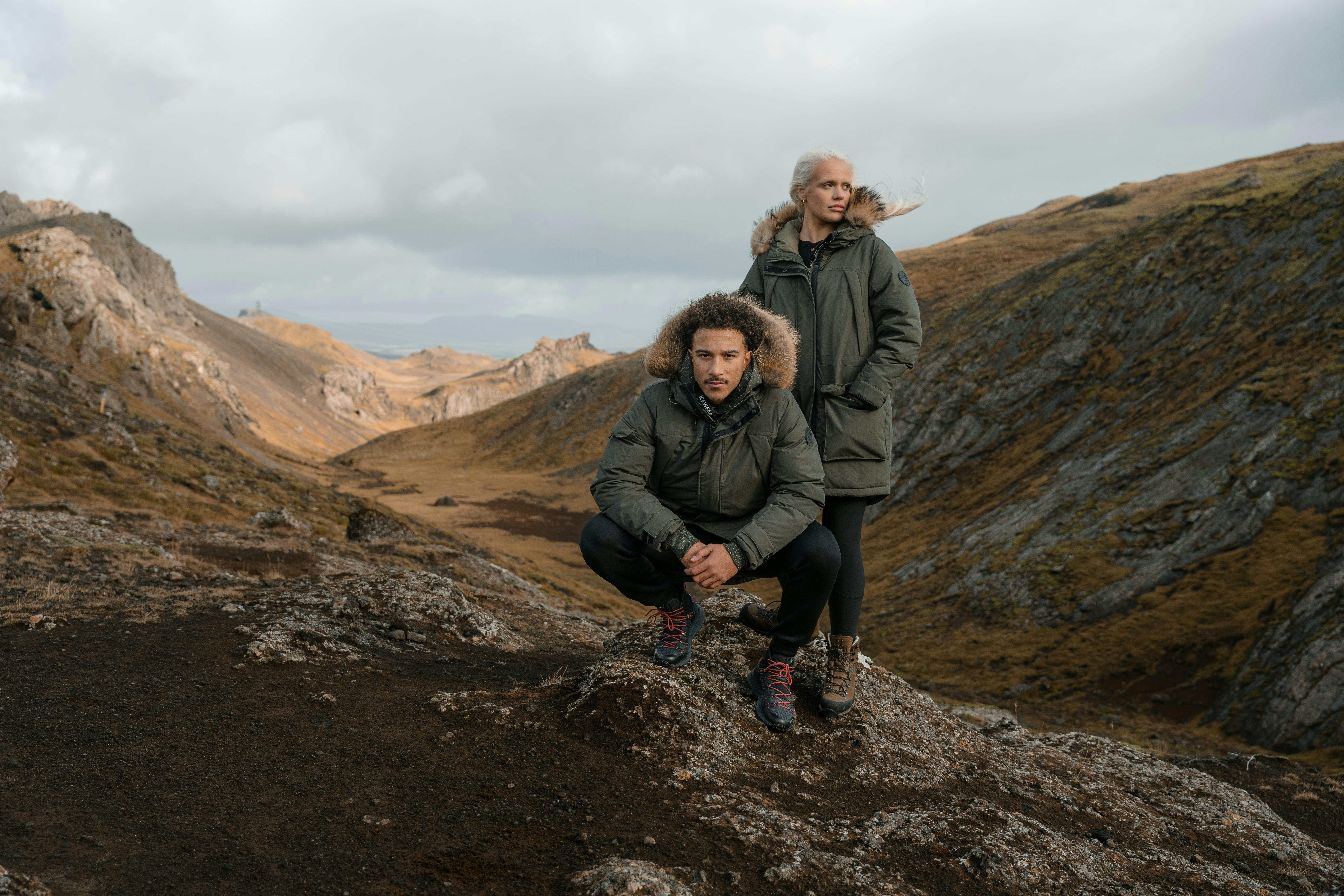 couple in warm winter jacket in the mountain