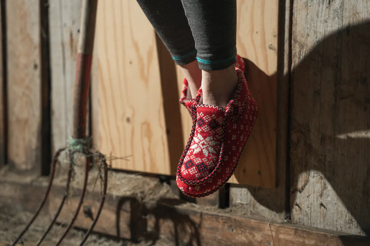 red cozy slippers with Norwegian pattern