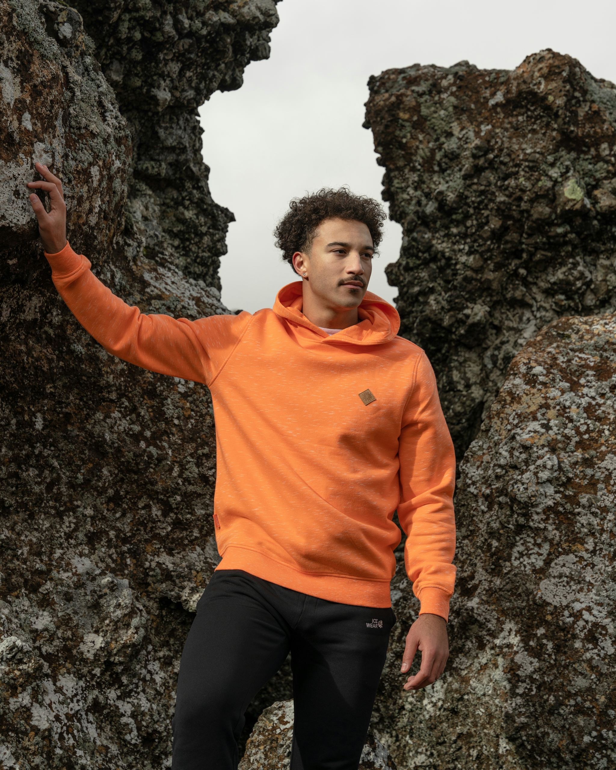 man-standing-orange-hoodie-31.jpeg