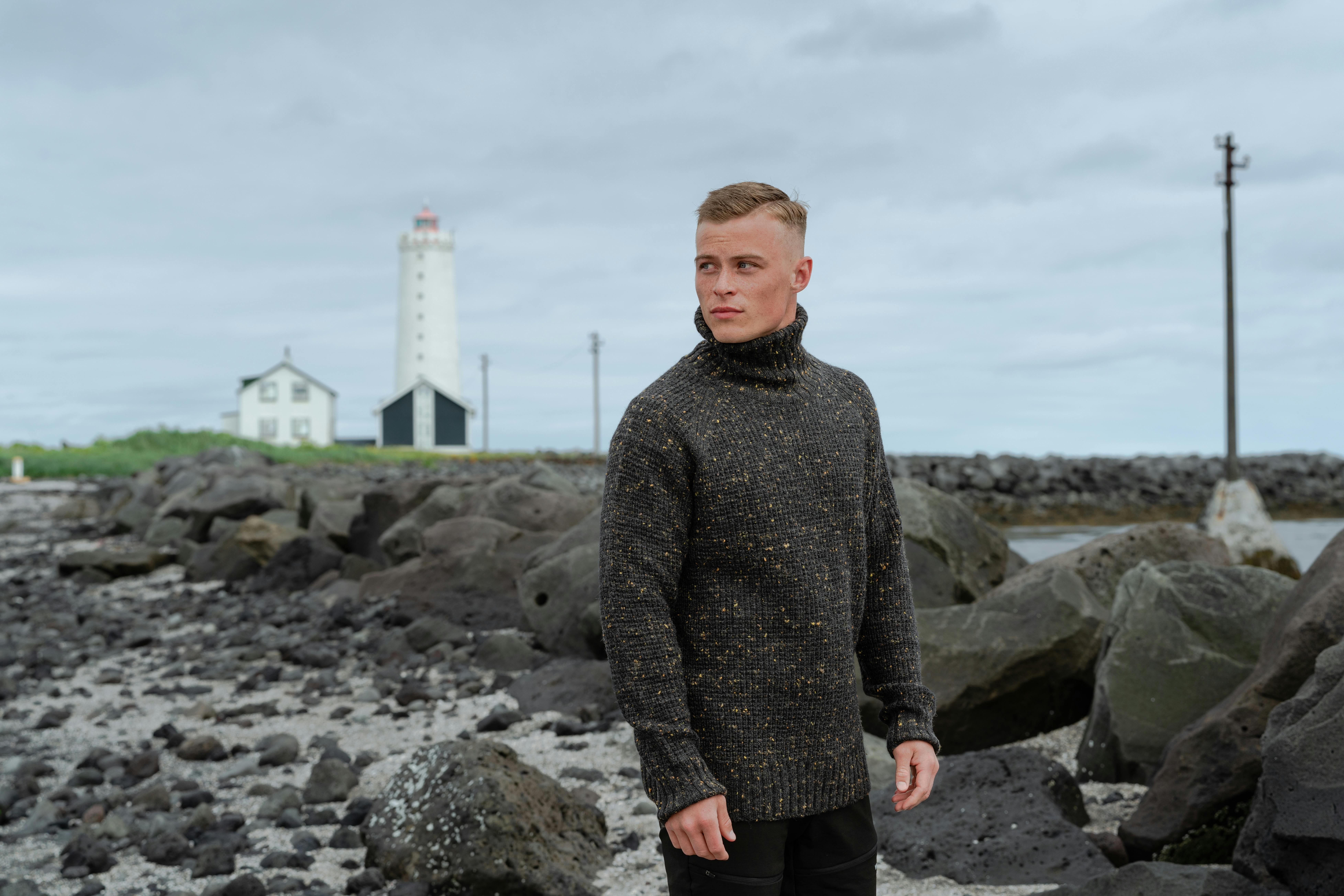 Man on the beach, near the lighthouse