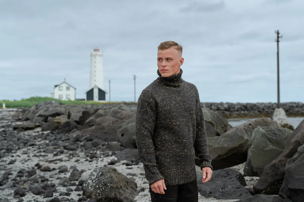 Man on the beach, near the lighthouse