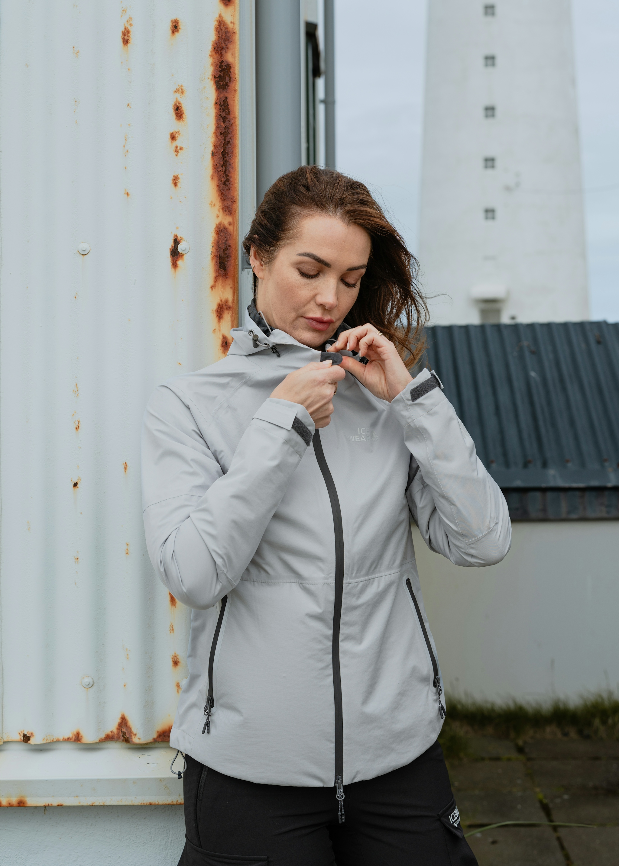woman-lightgrey-jacket-lighthouse.jpeg