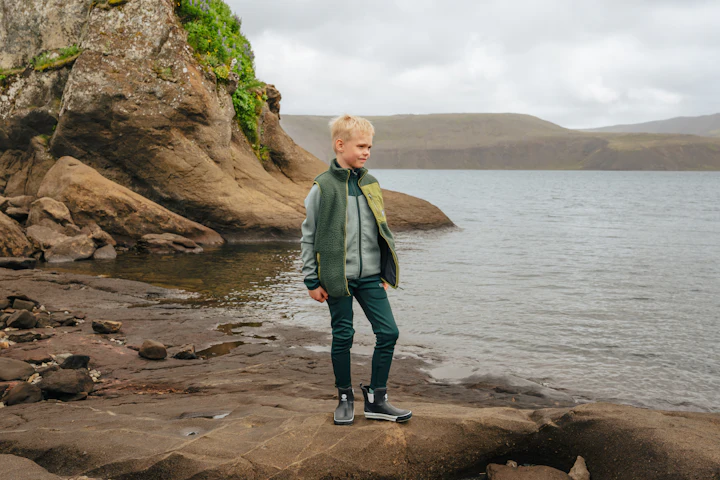 kid standing by the Icelandic sea
