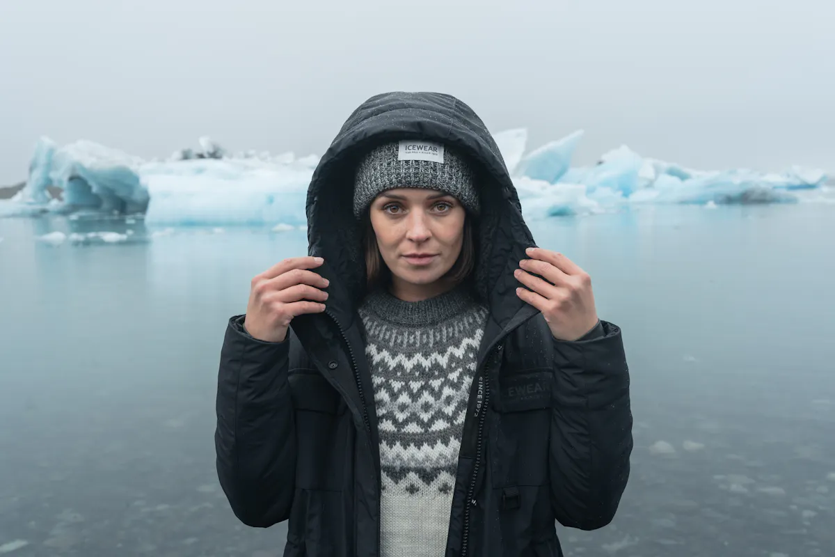 woman by glacier lagoon