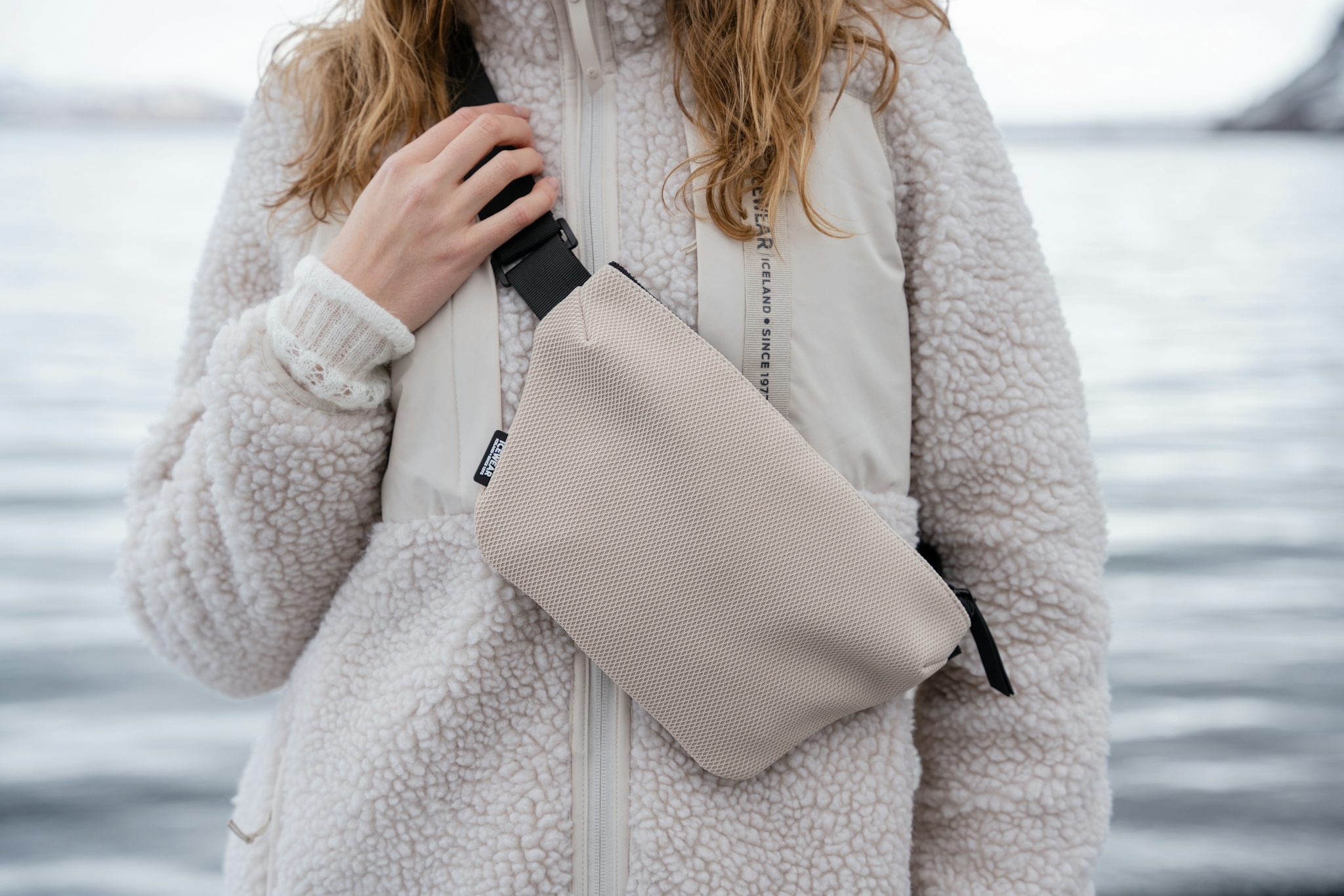iceland-woman-bumbag-white-sherpa-coat-13.jpeg