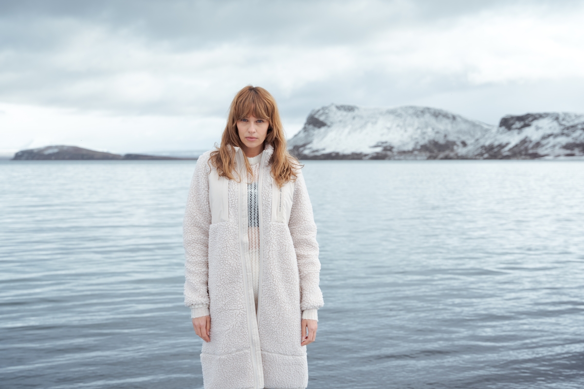 iceland-woman-snow-lake-white-sherpa-coat-2.jpeg
