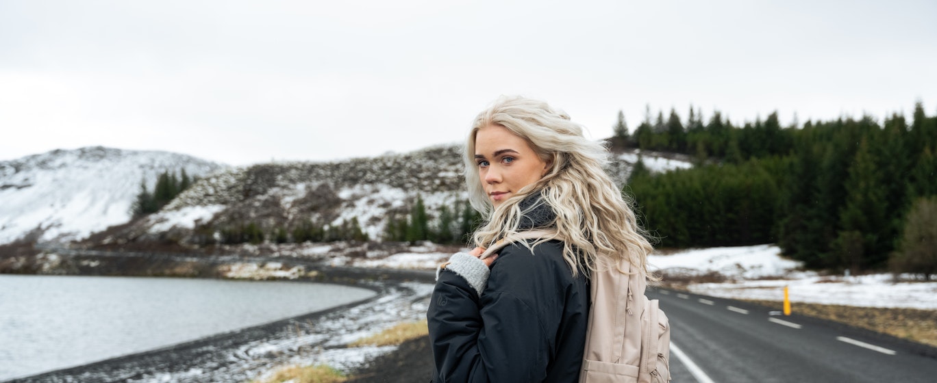 woman walking in middle of the road