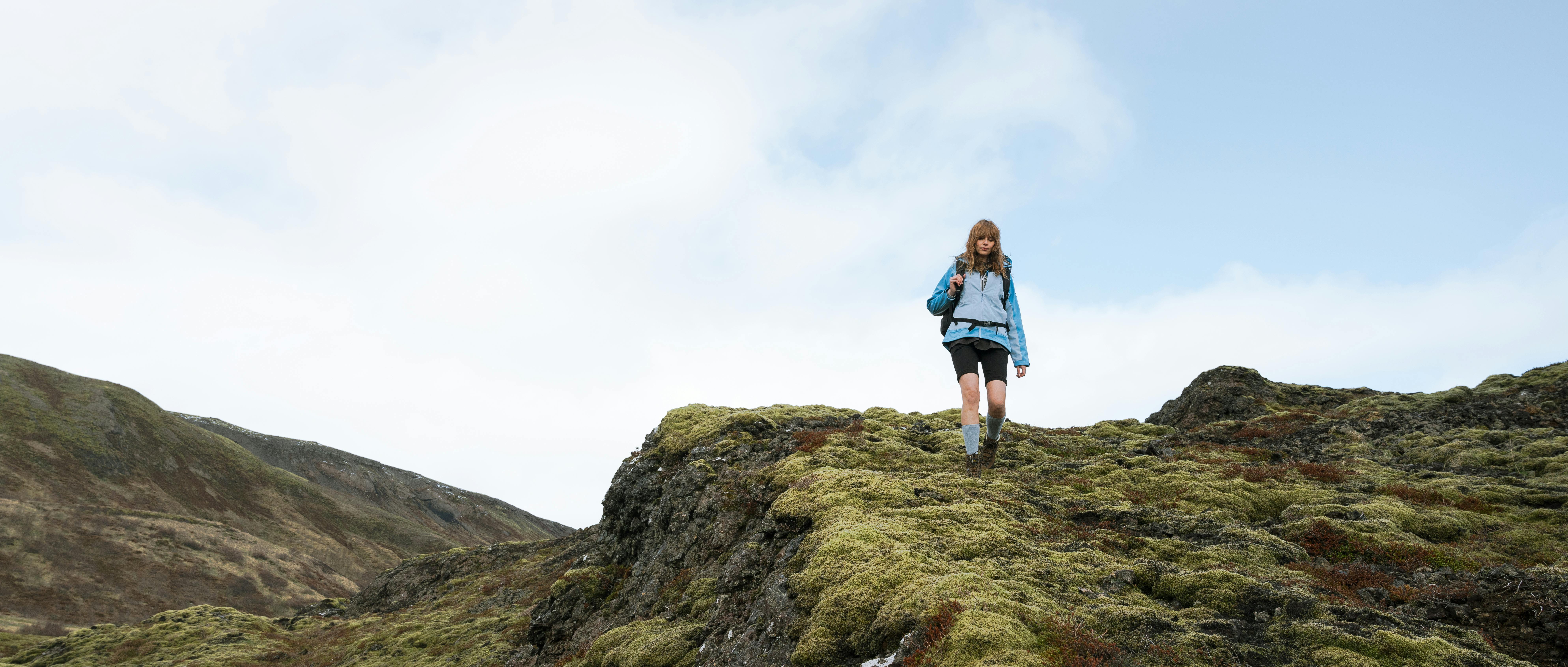 woman hiking down the mountain