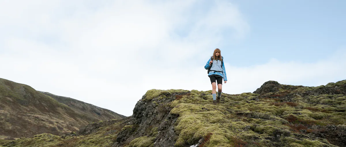 woman hiking down the mountain