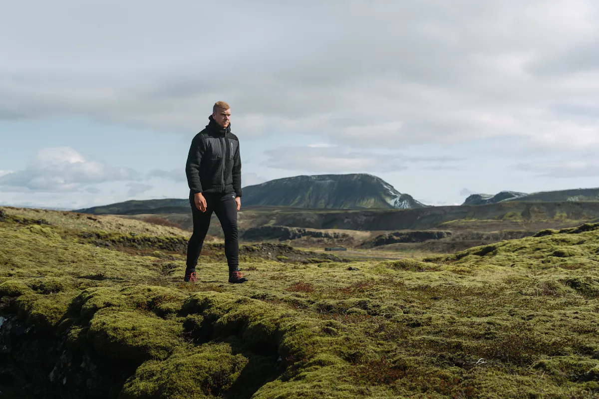 man walking in moss nature in Iceland