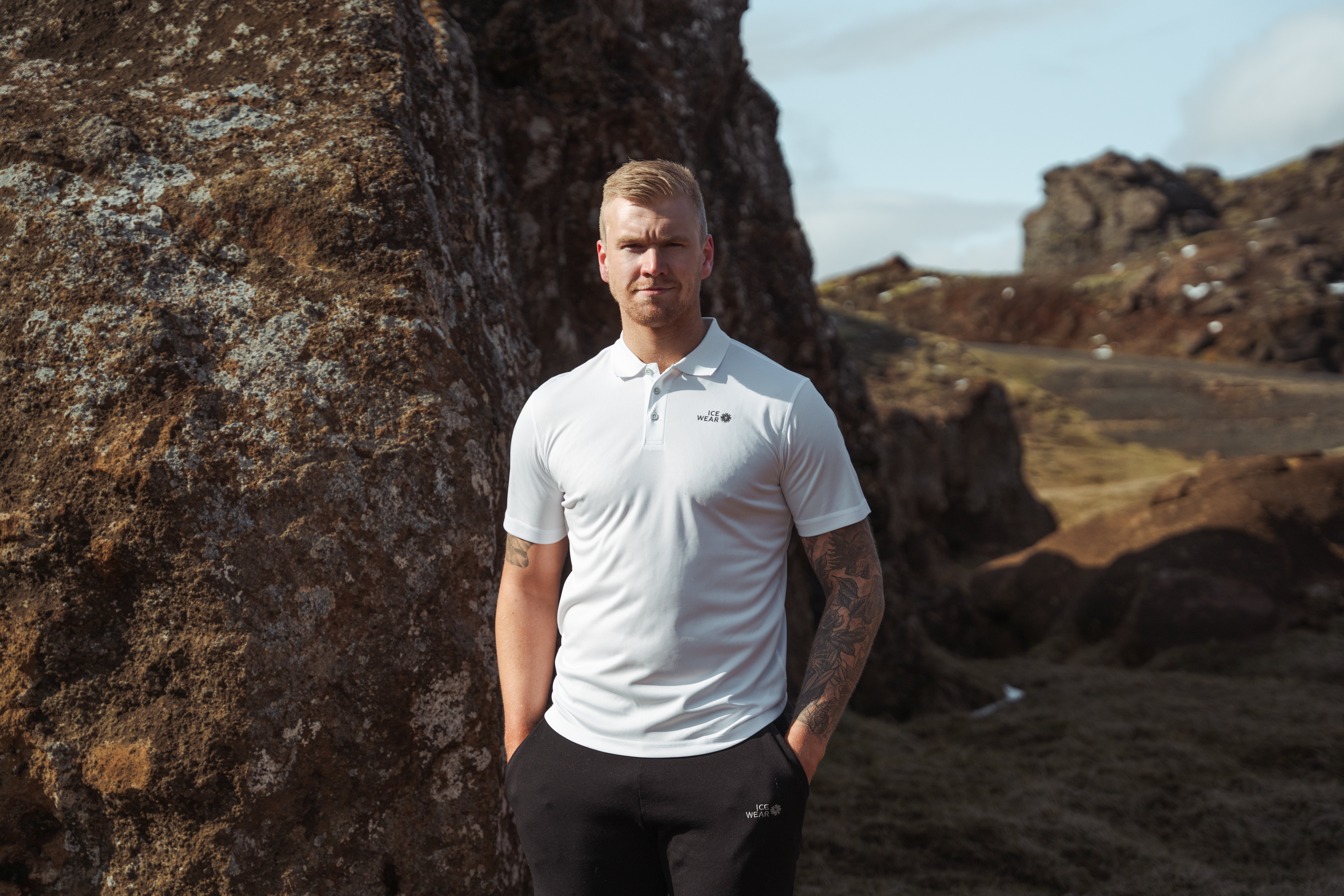 man standing by a cliff