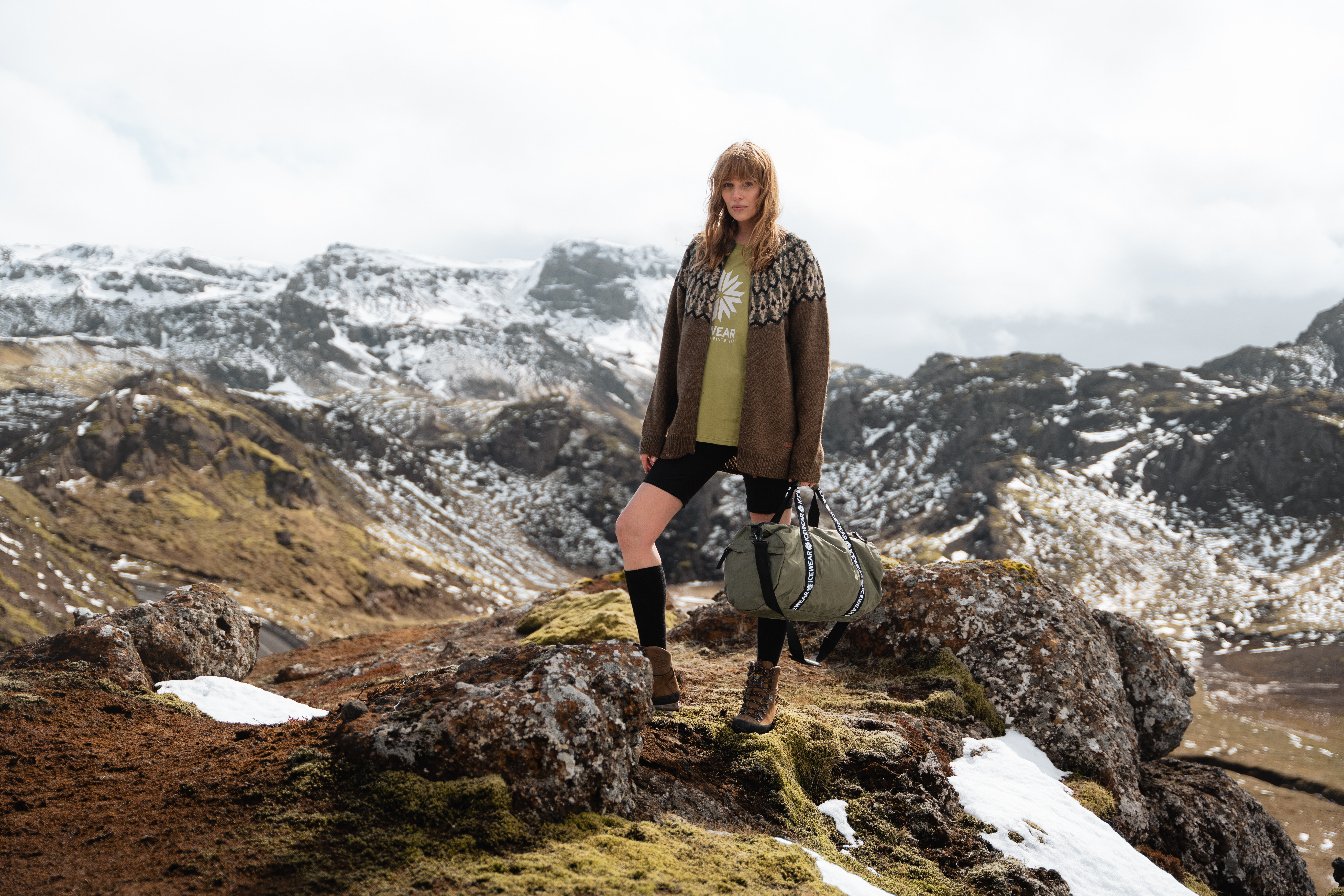 woman standing on a mountain in Iceland