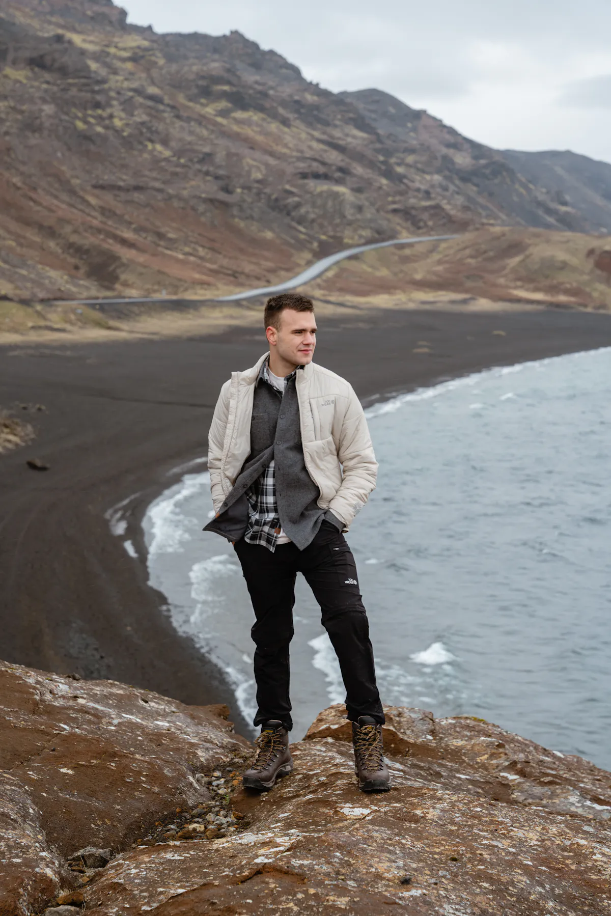 man next to the sea in a windy day in Iceland