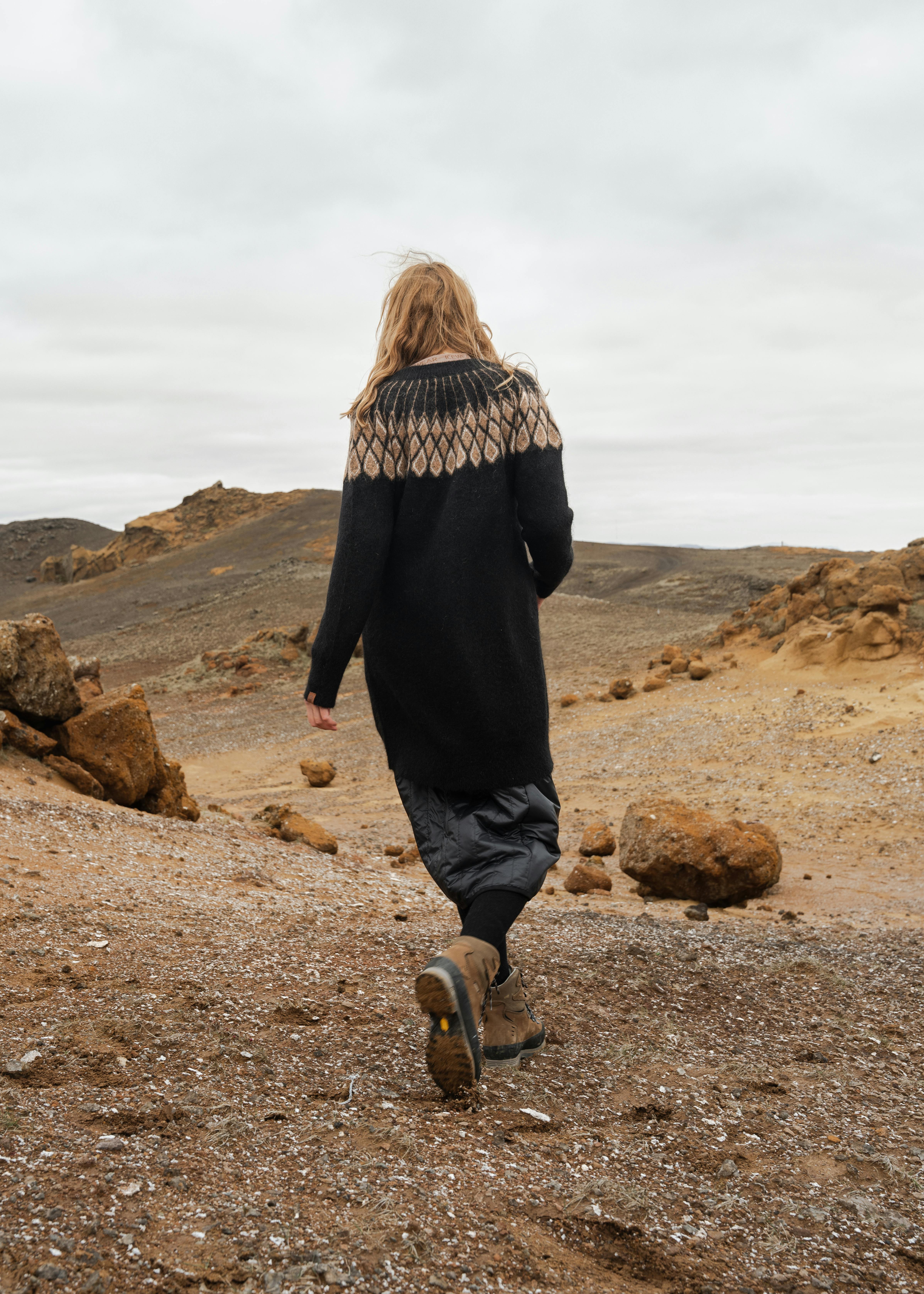 woman walking in rocky nature