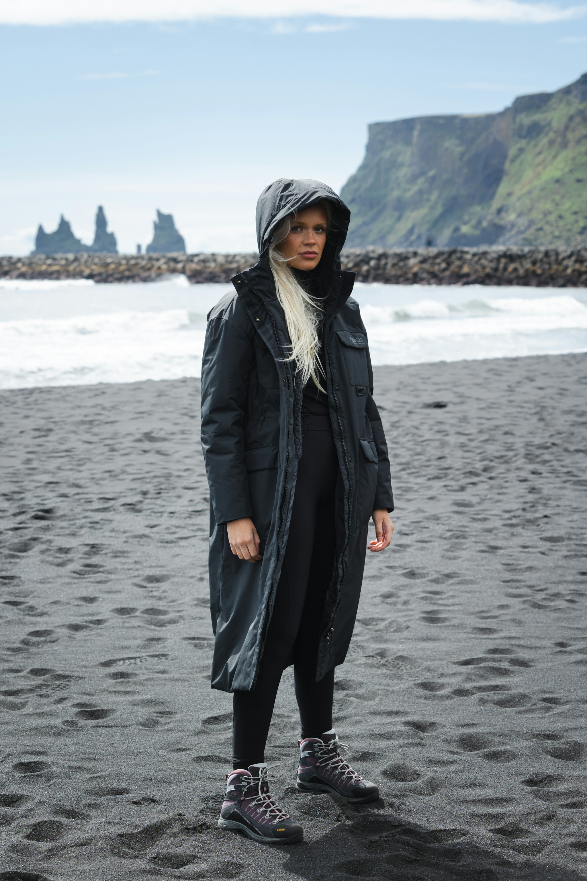 woman-long-black-jacket-beach-3.jpeg