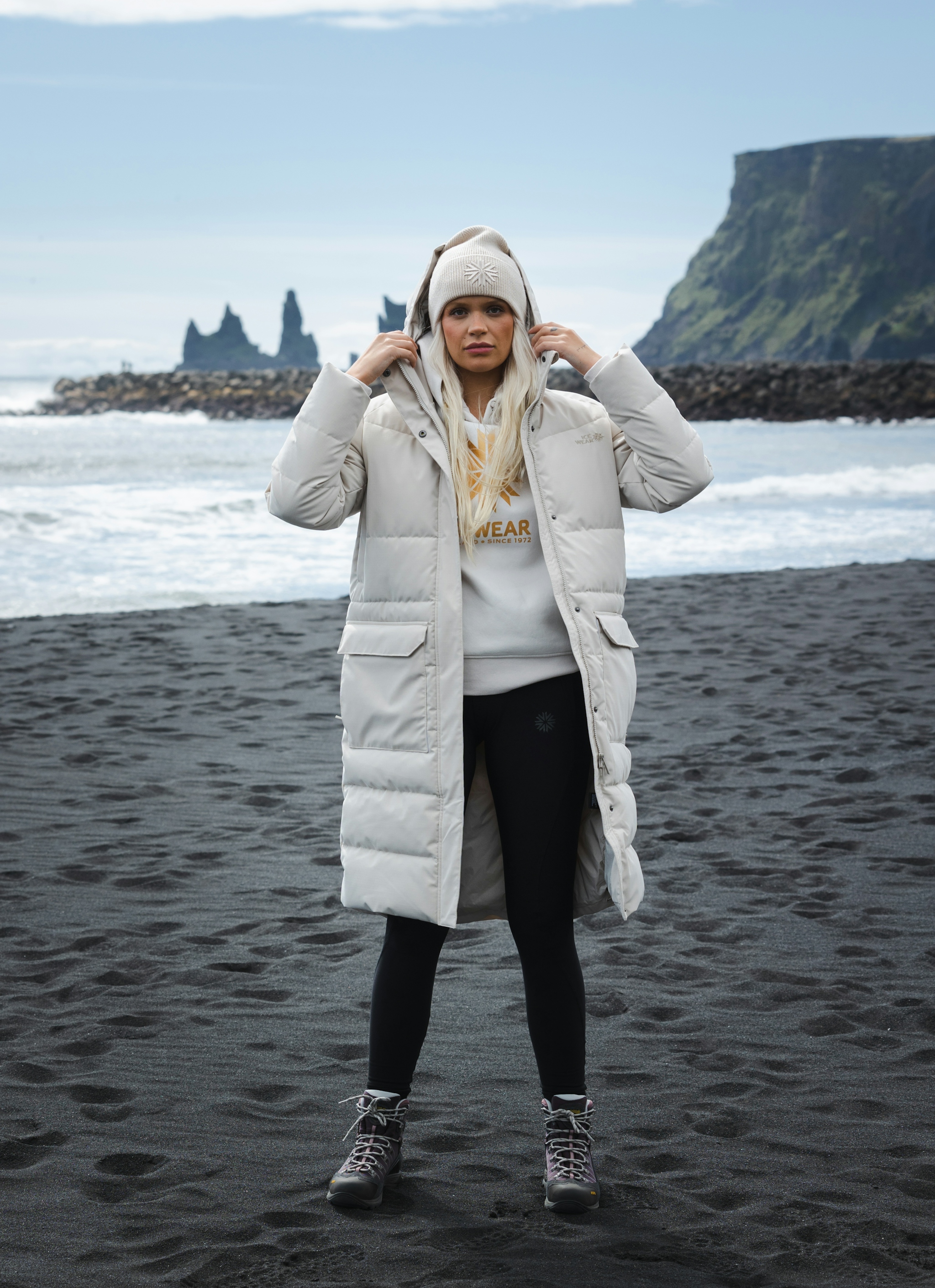 woman-white-long-jacket-blackbeach.jpeg