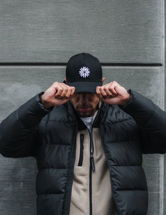 man with a black cap