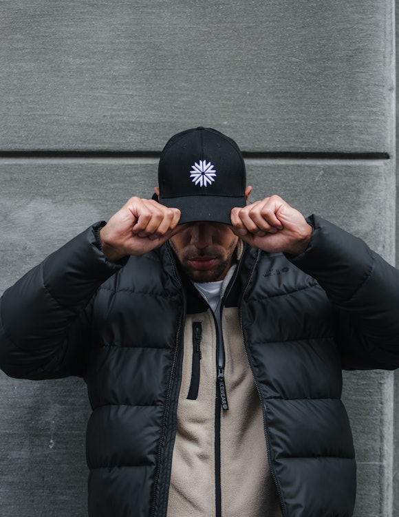 man with a black cap