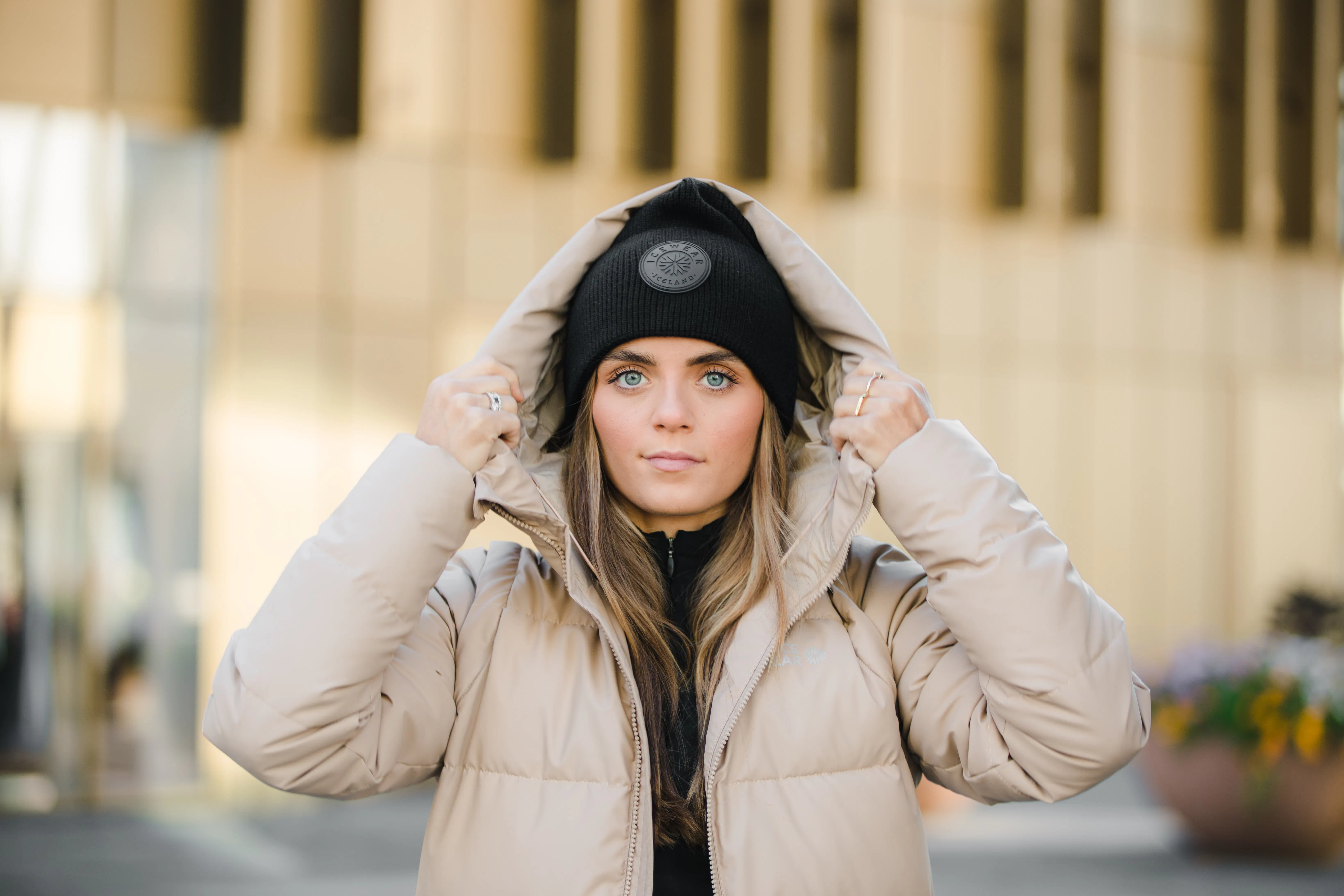 woman wearing winter jacket and a hat in Reykjavík city center