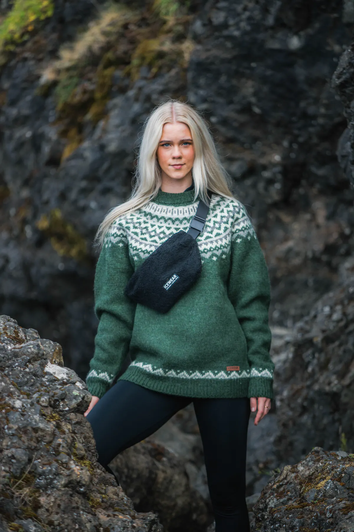 woman in Icelandic wool sweater in lava nature in Iceland