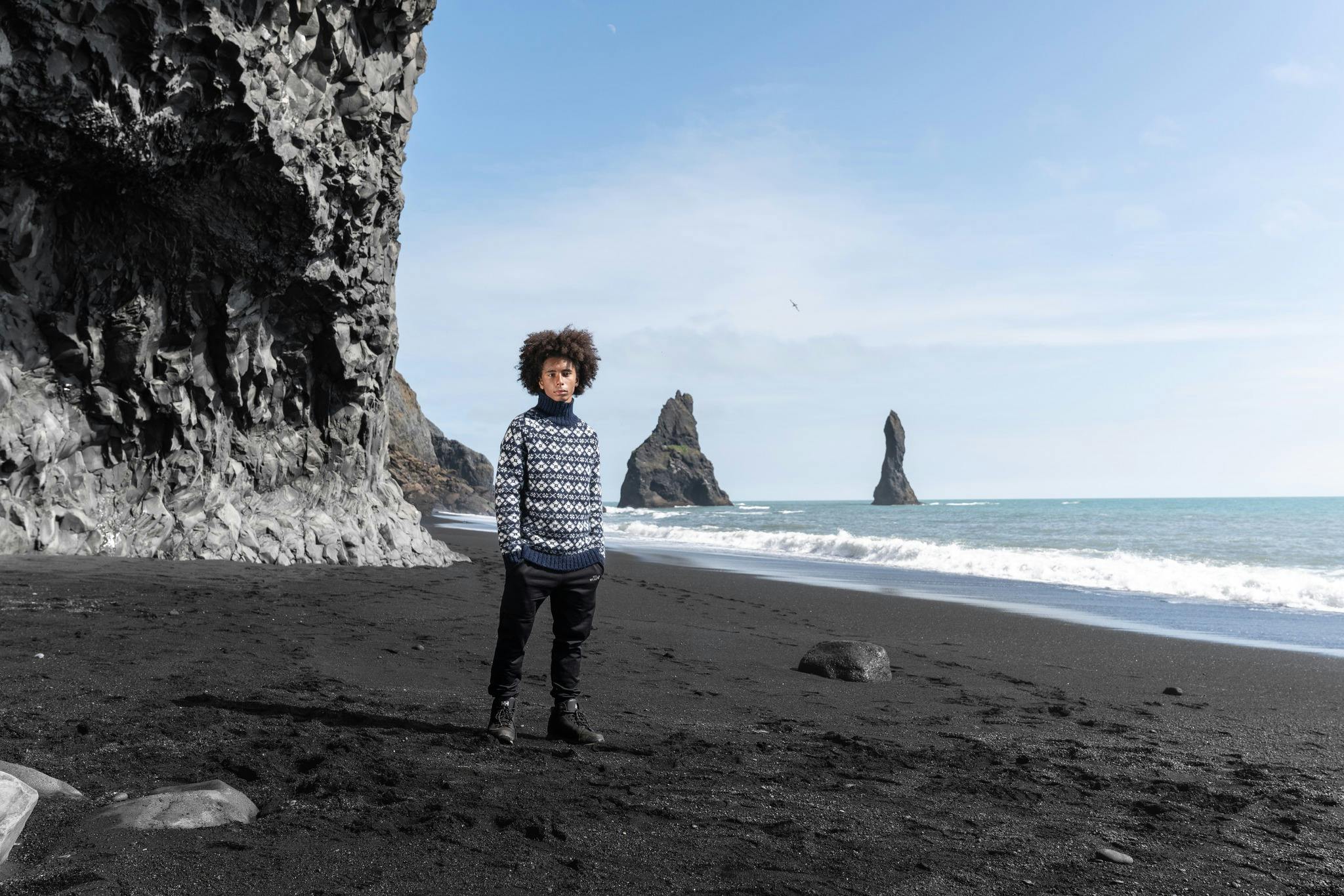 Man on Black beach in south Iceland