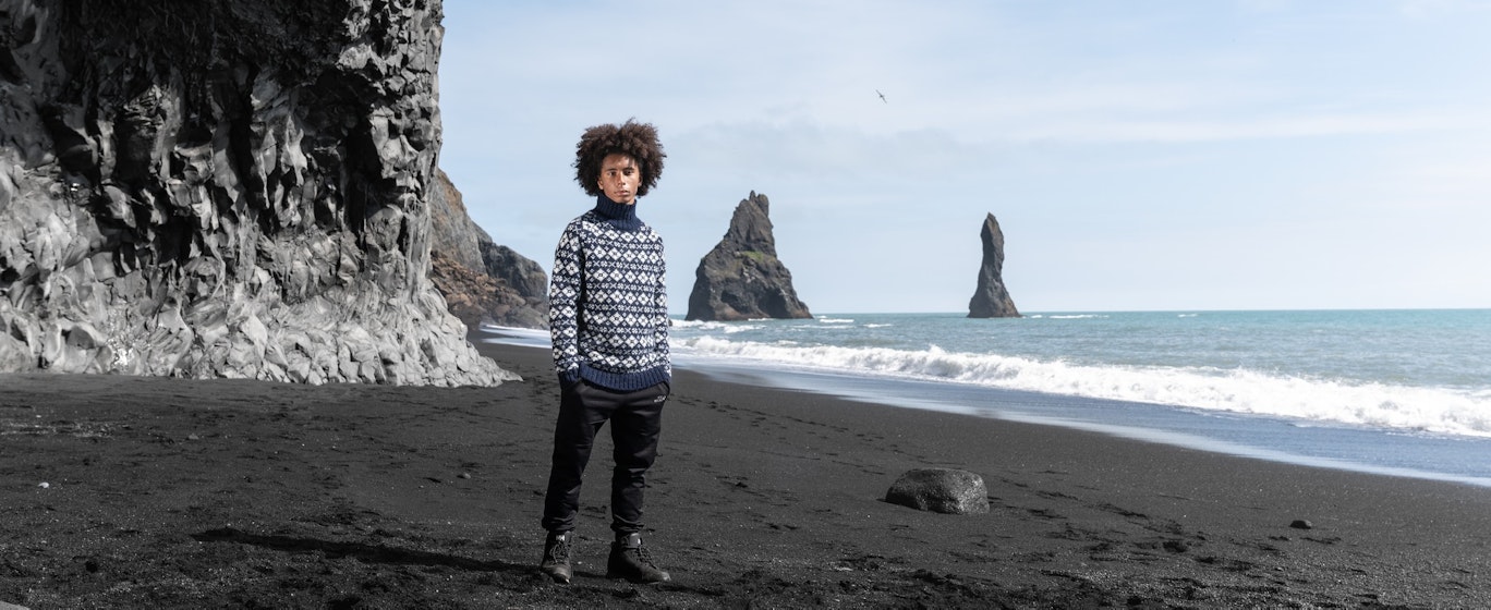 Man on Black beach in south Iceland