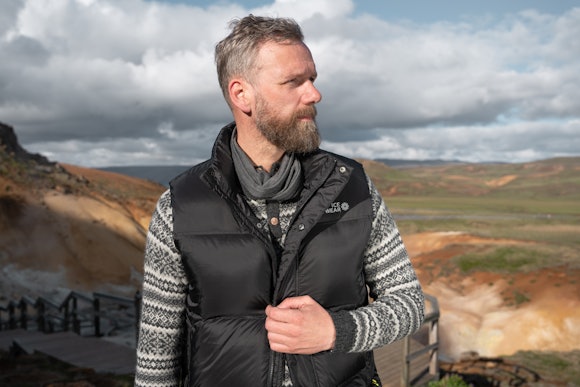man standing by the Icelandic hot springs