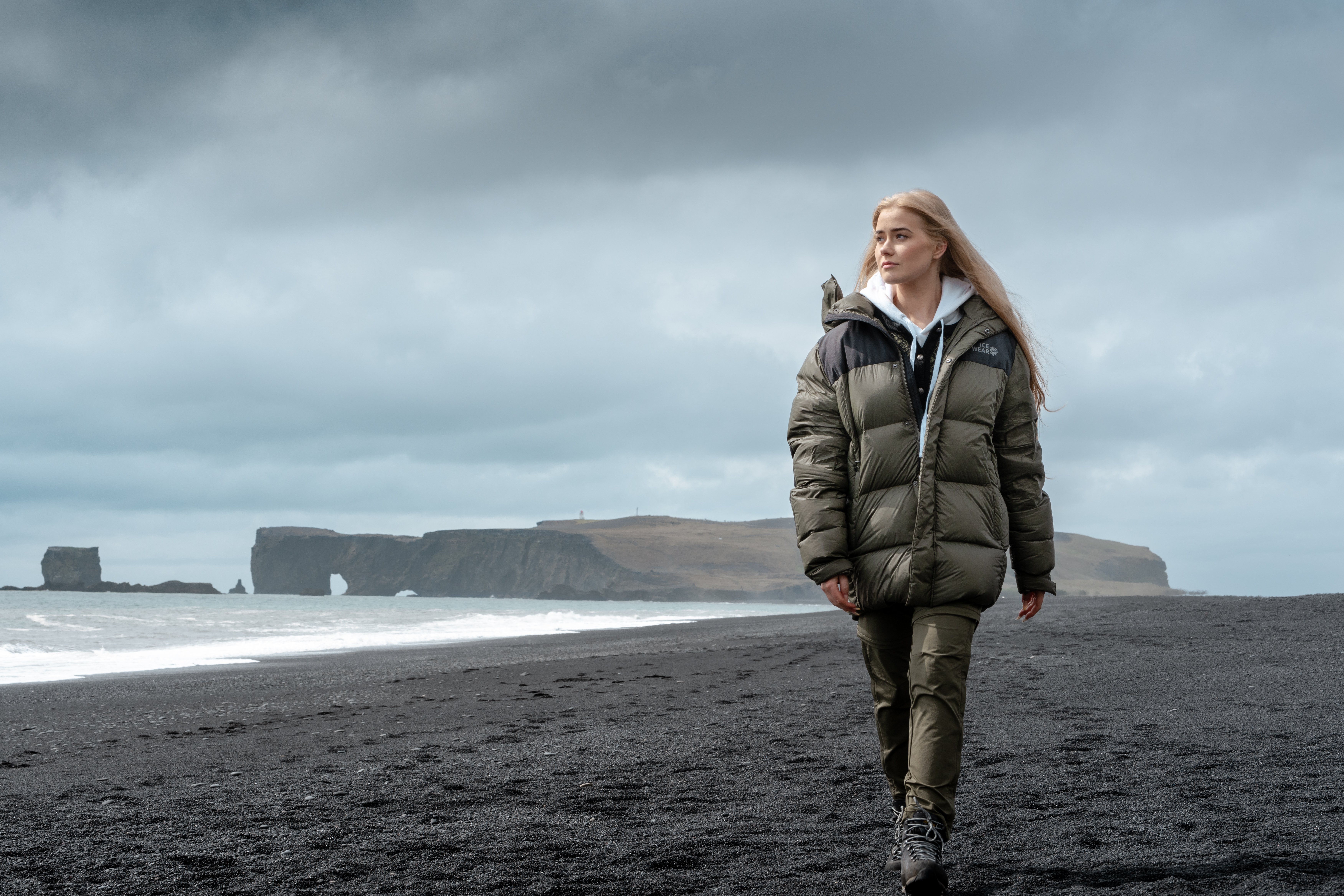 woman walking on black beach in south Iceland