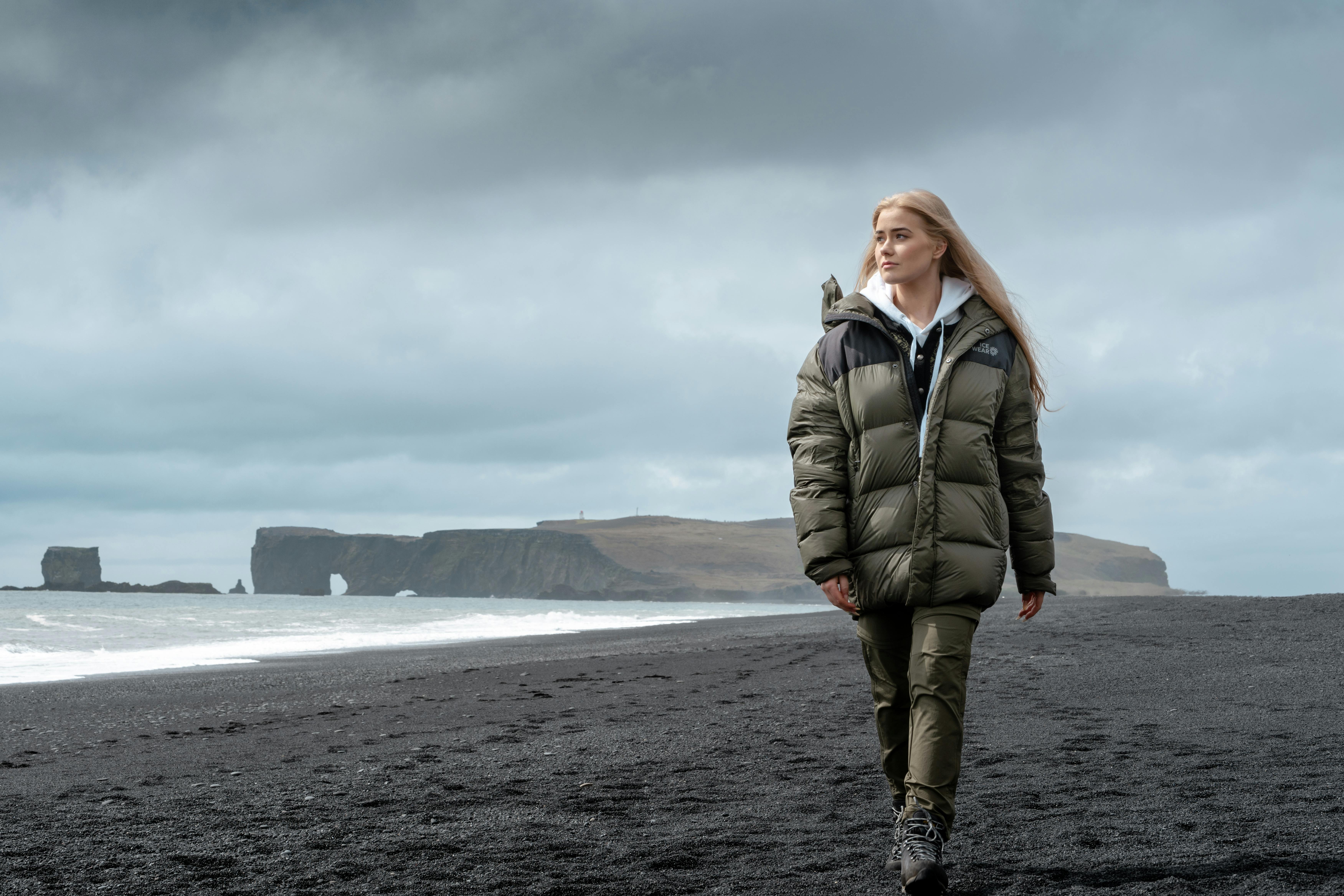 woman walking on black beach in south Iceland