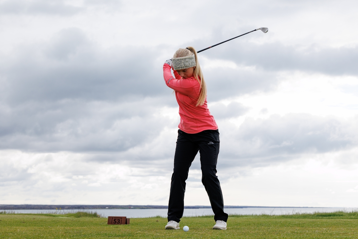 0328-woman-playing-golf-iceland.jpeg