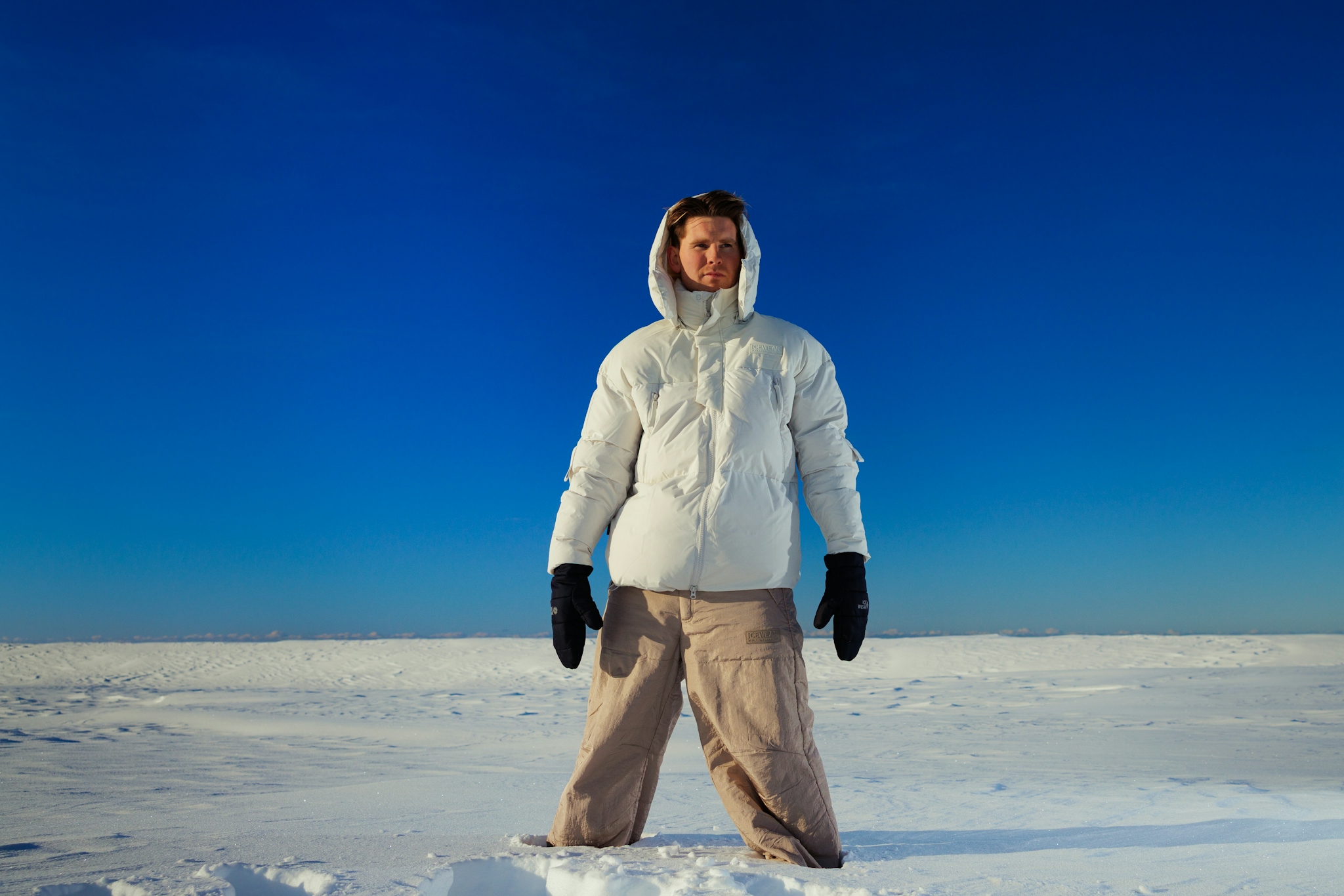 man-in-white-puffer-jacket-and-base-snowpants-4.jpeg